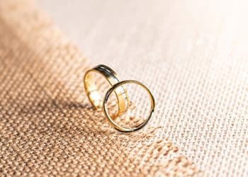 silver ring on brown textile
